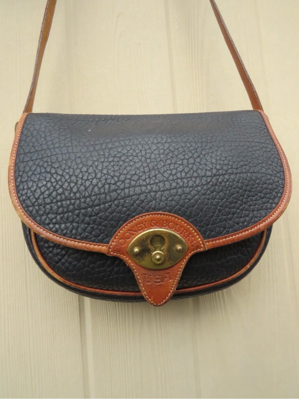 Dooney & Bourke Black with Brown Trim Pebble Leather Crossbody